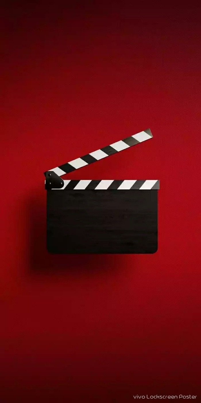 Clapperboard on a red background